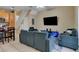 Comfortable living room with a view of the kitchen area, creating a seamless flow for modern living at 2328 Caravelle Cir, Kissimmee, FL 34746
