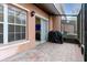 Cozy screened patio with brick flooring, an outdoor grill and direct access to the interior at 2328 Caravelle Cir, Kissimmee, FL 34746