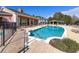 Community pool with lounge seating, a gazebo and landscaped surroundings at 2328 Caravelle Cir, Kissimmee, FL 34746
