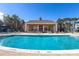 Large community pool with shallow end access and clubhouse in the background at 2328 Caravelle Cir, Kissimmee, FL 34746