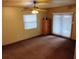 Bedroom featuring a large window, a ceiling fan, and a sliding glass door to an outdoor area at 235 Ruth Blvd, Longwood, FL 32750