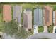 Aerial view of the property showcasing the roof, adjacent homes, and landscaping at 25239 Cranes Roost Cir, Leesburg, FL 34748