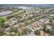 Beautiful aerial view of a lovely community, with a golf course and lake nearby at 25239 Cranes Roost Cir, Leesburg, FL 34748
