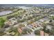 Beautiful aerial view of a lovely community, with a golf course and lake nearby at 25239 Cranes Roost Cir, Leesburg, FL 34748