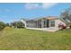 View of the backyard and screened in lanai at 25239 Cranes Roost Cir, Leesburg, FL 34748