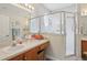This spacious bathroom features a wide vanity and a shower, providing a comfortable and functional space at 25239 Cranes Roost Cir, Leesburg, FL 34748