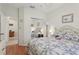 Bedroom showcasing a mirrored closet, hardwood floors, and a light and airy atmosphere at 25239 Cranes Roost Cir, Leesburg, FL 34748