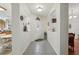 Bright foyer featuring arched openings, tile flooring, and views into adjacent rooms at 25239 Cranes Roost Cir, Leesburg, FL 34748