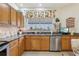 Kitchen featuring granite countertops, stainless steel appliances, and ample cabinet space at 25239 Cranes Roost Cir, Leesburg, FL 34748