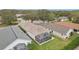 Backyard view of this beautiful home featuring a screened lanai perfect for enjoying the outdoors at 25239 Cranes Roost Cir, Leesburg, FL 34748