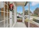 Relax and enjoy the weather on your screened porch, providing fresh air and a view of the neighborhood at 25239 Cranes Roost Cir, Leesburg, FL 34748