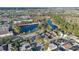High angle aerial shot of the property near a beautiful lake and commercial areas at 3001 Bellingham Dr, Orlando, FL 32825
