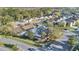 Aerial view of the community with manicured lawns and neighborhood signage: The Enclave at 3001 Bellingham Dr, Orlando, FL 32825