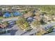 Scenic aerial view of the house nestled near a tranquil lake and lush green trees at 3001 Bellingham Dr, Orlando, FL 32825