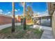 Cozy backyard featuring a screened-in porch, brick features, and two palm trees at 3001 Bellingham Dr, Orlando, FL 32825