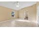 Bright bedroom featuring tile flooring, natural light, neutral paint, and an archway for an open and airy feel at 3001 Bellingham Dr, Orlando, FL 32825