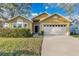 Charming single Gathering home featuring an attached garage and a well manicured lawn in a desirable neighborhood at 3001 Bellingham Dr, Orlando, FL 32825