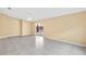 Open-concept living area featuring neutral walls, sliding glass doors, and tile floors, offering seamless indoor-outdoor living at 3001 Bellingham Dr, Orlando, FL 32825