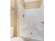All white tiled shower with built in seats, shower head, and glass door at 3001 Bellingham Dr, Orlando, FL 32825