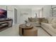 Cozy living room with a sectional sofa, layered coffee tables, and modern decor creating a welcoming atmosphere at 3021 Moulin Rd, Davenport, FL 33837
