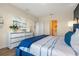 Inviting bedroom with a plush bed, elegant decor, and a bright atmosphere, with a glimpse into the ensuite bath at 3178 Partington Blvd, Davenport, FL 33837