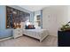This bedroom features a chalk wall, unique artwork and decor, and a window letting in natural light at 3178 Partington Blvd, Davenport, FL 33837