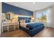 Comfortable bedroom features a king-size bed, modern decor, and a calming color scheme with natural light at 3178 Partington Blvd, Davenport, FL 33837