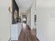 Inviting hallway featuring luxury vinyl plank flooring, stylish decor, and ample natural light at 3178 Partington Blvd, Davenport, FL 33837