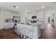Well-equipped kitchen featuring stainless steel appliances, a central island with seating, and ample cabinet space at 3178 Partington Blvd, Davenport, FL 33837