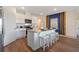 Modern kitchen with a large island, stainless steel appliances, and a stylish backsplash at 3178 Partington Blvd, Davenport, FL 33837