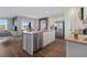 Spacious kitchen with stainless steel appliances, a central island, and an adjacent dining area at 3178 Partington Blvd, Davenport, FL 33837