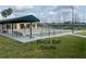 Active bocce ball courts with players under shaded pavilions in a community park at 321 Davinci Pass, Kissimmee, FL 34759
