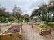 Picture of organized community garden with raised garden beds and gravel pathways at 321 Davinci Pass, Kissimmee, FL 34759