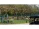 Fenced dog park with benches, play structures, and artificial turf at 321 Davinci Pass, Kissimmee, FL 34759