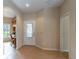 Bright foyer with tile flooring, decorative front door, and an arched doorway at 321 Davinci Pass, Kissimmee, FL 34759