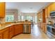 Bright kitchen featuring wood cabinets, tile flooring and stainless steel appliances at 321 Davinci Pass, Kissimmee, FL 34759