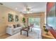 Comfortable living room with tile floors, neutral colors, and patio access at 321 Davinci Pass, Kissimmee, FL 34759