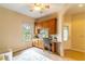 Cozy home office with a built-in desk, cabinet storage, and natural light from the window at 321 Davinci Pass, Kissimmee, FL 34759