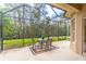 Covered patio with a view of trees at 321 Davinci Pass, Kissimmee, FL 34759