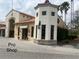 Exterior view of the pro shop with stone accents and well-manicured landscaping at 321 Davinci Pass, Kissimmee, FL 34759