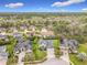 Aerial view of the home, showcasing its location in a well-established neighborhood with mature trees at 3840 Stone Pine Ct, Oviedo, FL 32766