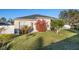 Back exterior of house with green lawn, shade trees, and privacy fence at 3930 Hydrangea Ct, Oviedo, FL 32766