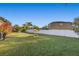 Expansive backyard with a well-maintained lawn, privacy fence and mature trees and plant life at 3930 Hydrangea Ct, Oviedo, FL 32766