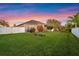 Spacious backyard featuring a lush lawn and well-maintained landscaping, perfect for outdoor activities at 3930 Hydrangea Ct, Oviedo, FL 32766