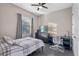 Bedroom featuring neutral walls, tiled floors, ceiling fan, and a large window at 3930 Hydrangea Ct, Oviedo, FL 32766