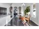 Bright dining area featuring dark floors, an ornamental chandelier, and a large window at 3930 Hydrangea Ct, Oviedo, FL 32766