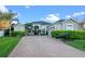 Charming single-story home with meticulously manicured landscaping and brick paved driveway at 3930 Hydrangea Ct, Oviedo, FL 32766