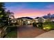 Beautiful single-story home featuring a large brick driveway and meticulously manicured landscaping at 3930 Hydrangea Ct, Oviedo, FL 32766
