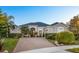 Beautiful single-story home featuring a large brick driveway and meticulously manicured landscaping at 3930 Hydrangea Ct, Oviedo, FL 32766