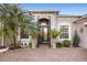 Stunning entryway with a brick path, decorative iron gate, and manicured plants at 3930 Hydrangea Ct, Oviedo, FL 32766